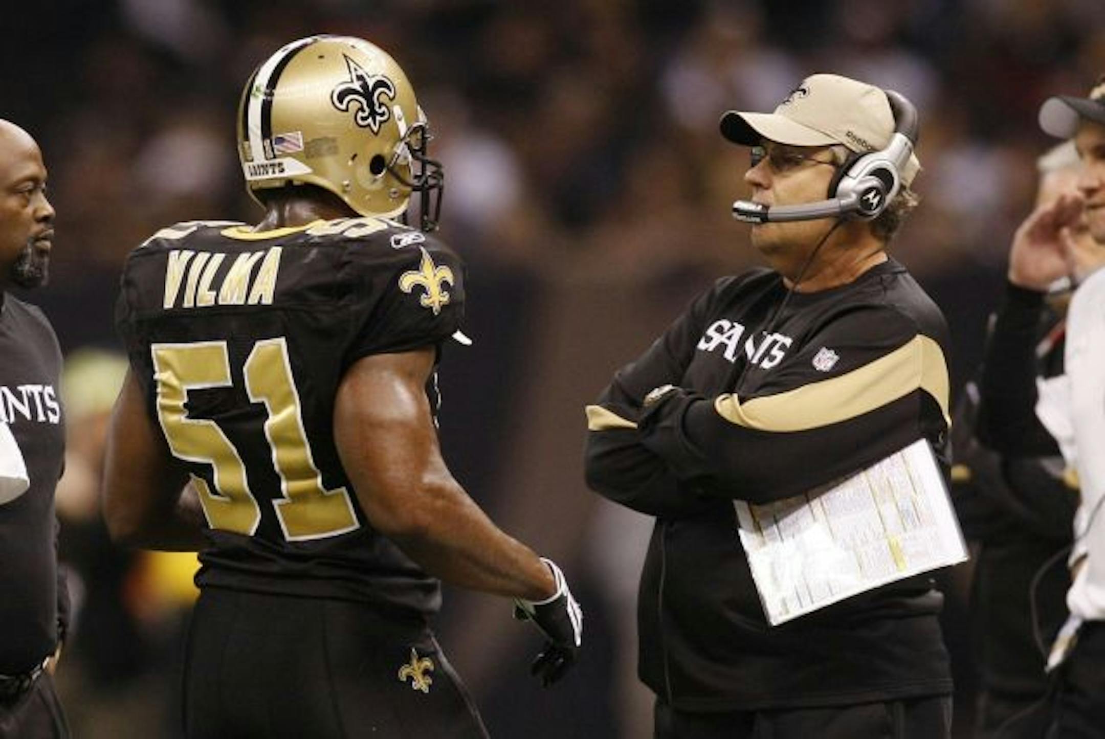NEW ORLEANS - DECEMBER 19: Jonathan Vilma #51 of the New Orleans Saints talks with defensive coordinator Gregg Williams in the first quarter against the Dallas Cowboys at Louisiana Superdome on December 19, 2009 in New Orleans, Louisiana.