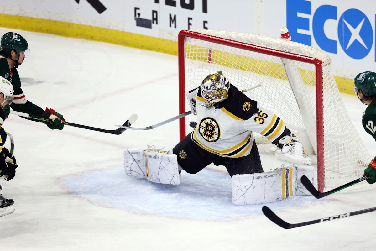 Minnesota Wild left wing Marcus Johansson, left, scores a goal against Boston Bruins goaltender Linus Ullmark (35) during the first period of an NHL h