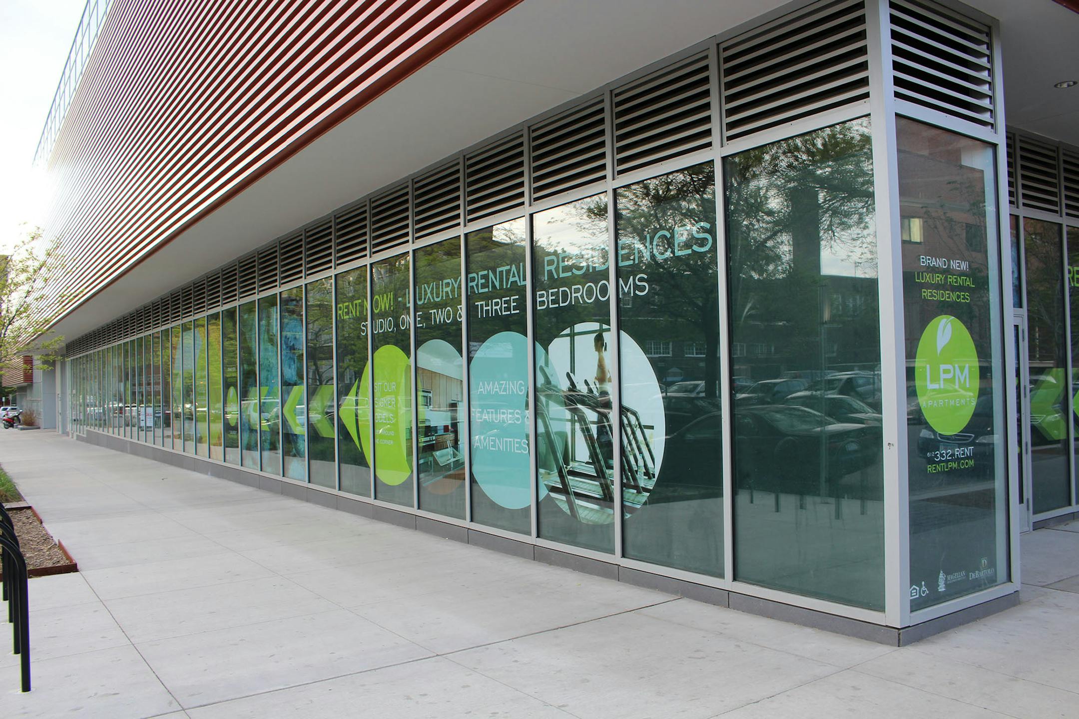 A diner and craft brewery are ultimately expected to fill the ground-level retail spaces. Cautioning it will take time for the retail to fully move in, Newberg pointed to the scarcity of doors and hypnotizing orange garage vents above the glass at Lasalle Ave. and 14th Street.