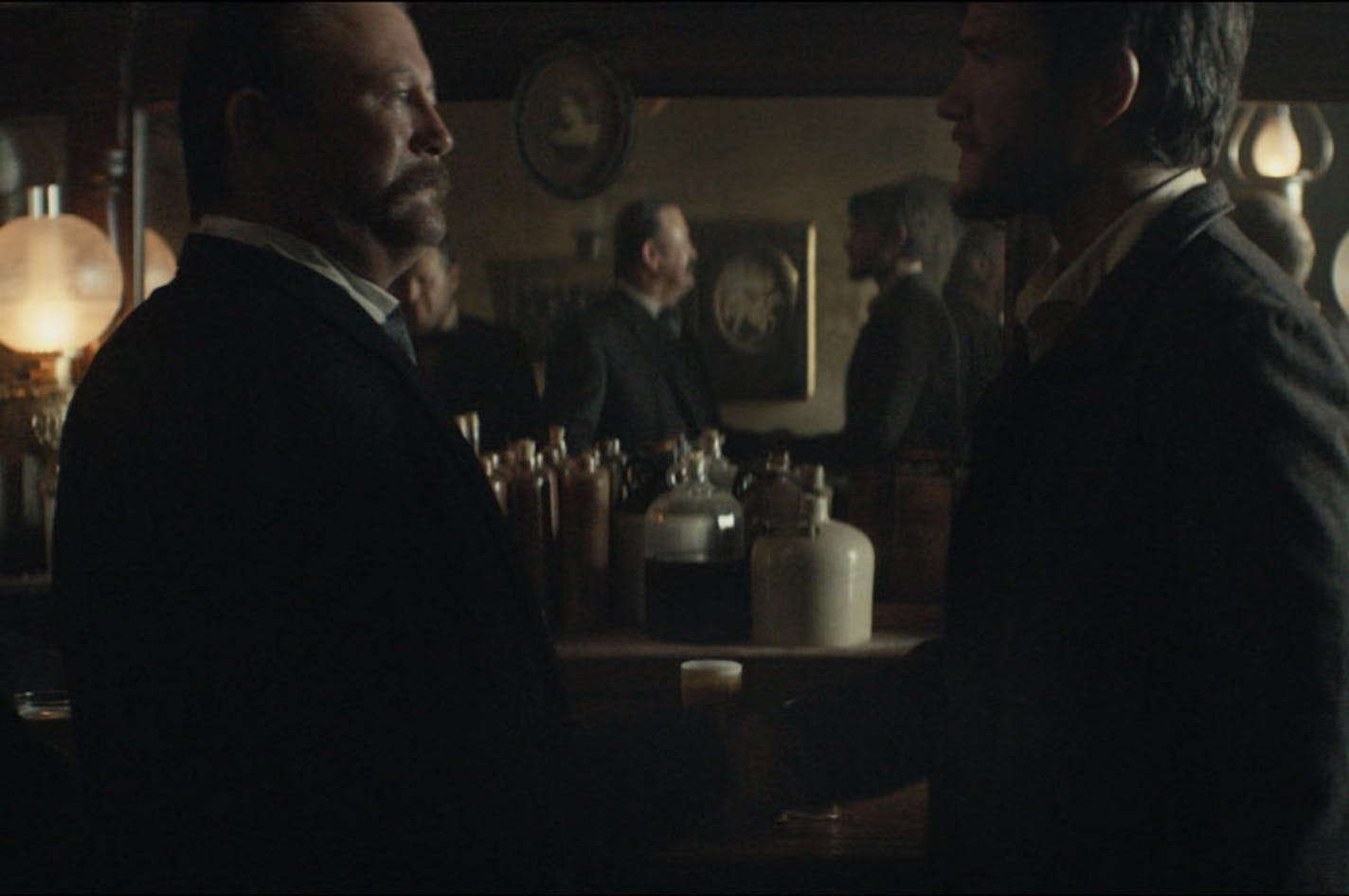 This photo provided by Budweiser shows a scene from the company's spot for Super Bowl 51. The scene depicts when Anheuser-Busch co-founder Adolphus Busch, right, after traveling by boat from Germany, met fellow immigrant Eberhard Anheuser. The New England Patriots defeated the Atlanta Falcons, 34-28, in overtime, in Super Bowl 51, on Sunday, Feb. 5, 2017. (Budweiser via AP)