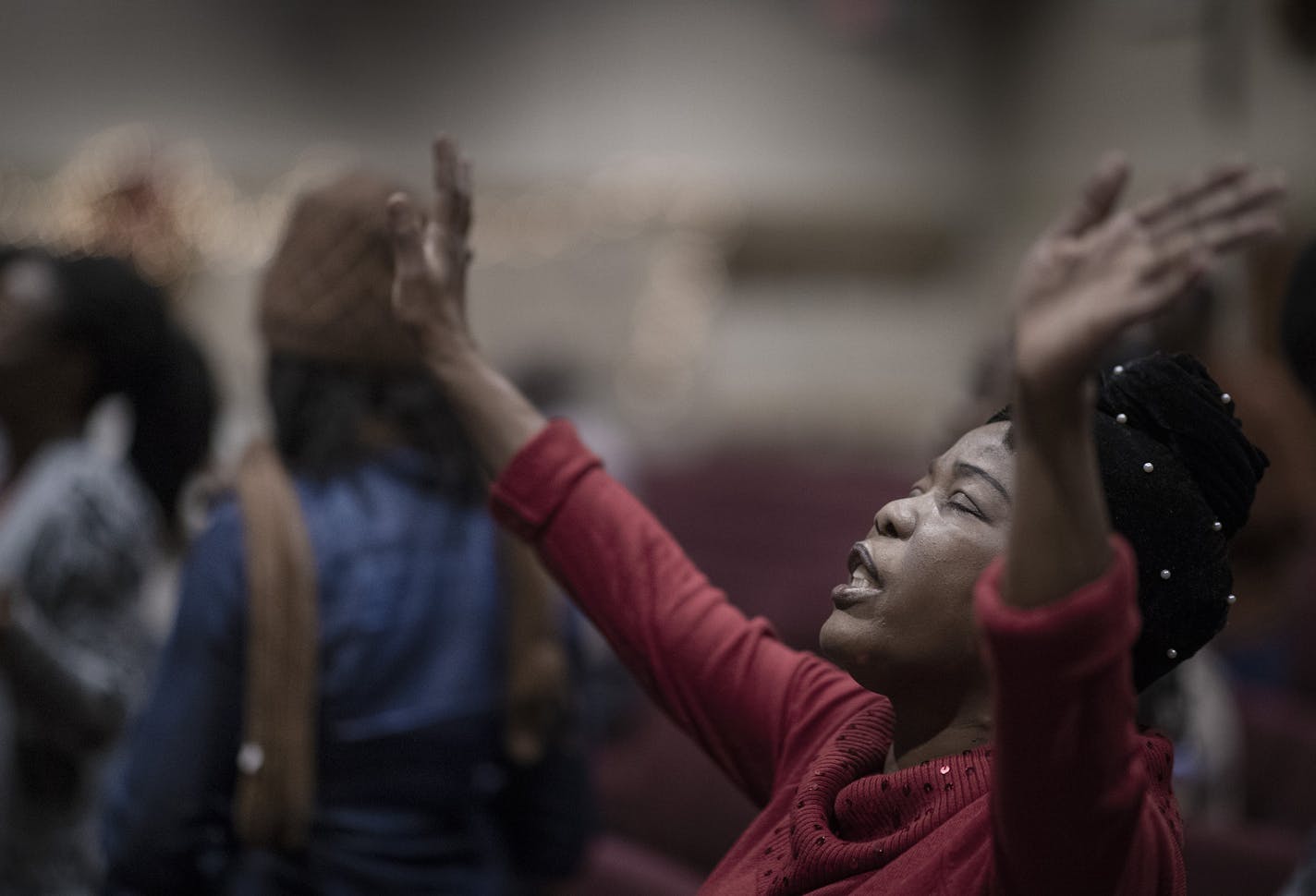 Deacon Kimma Redd Kardor of Brooklyn Park raised her hands in prayer as the congregation at Ebenezer Community Church thanked God for the Senates amendment that gives recipients of DED status permanent residency and a path to citizenship .] Jerry Holt &#x2022; Jerry.Holt@startribune.com Liberians react to the Senate passage of a defense bill that includes an amendment that gives recipients of DED status permanent residency and a path to citizenship, ending decades of uncertainty during prayer se