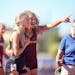 Maia Peterson of Stewartville, right, helped an exhausted Elle Kuechel of Eden Valley Watkins off the track after she collapsed at the finish line.