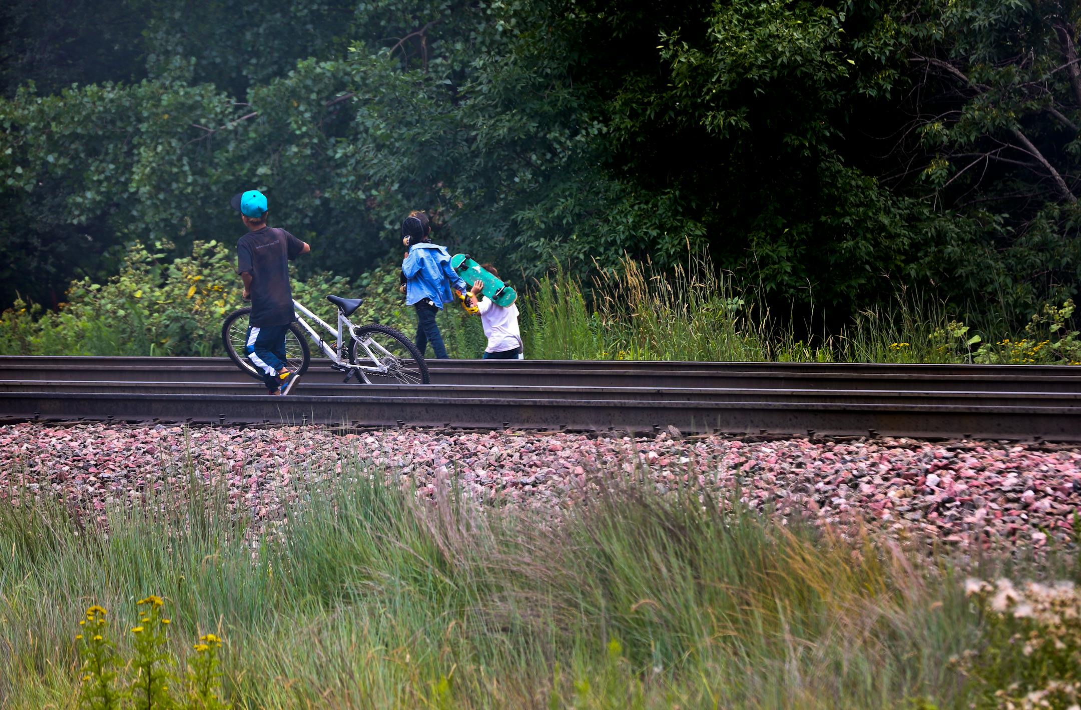 On Friday, a group of boys walked along train tracks in St. Paul a couple hundred yards away from where a 9-year-old was seriously injured by a passing train Thursday night.