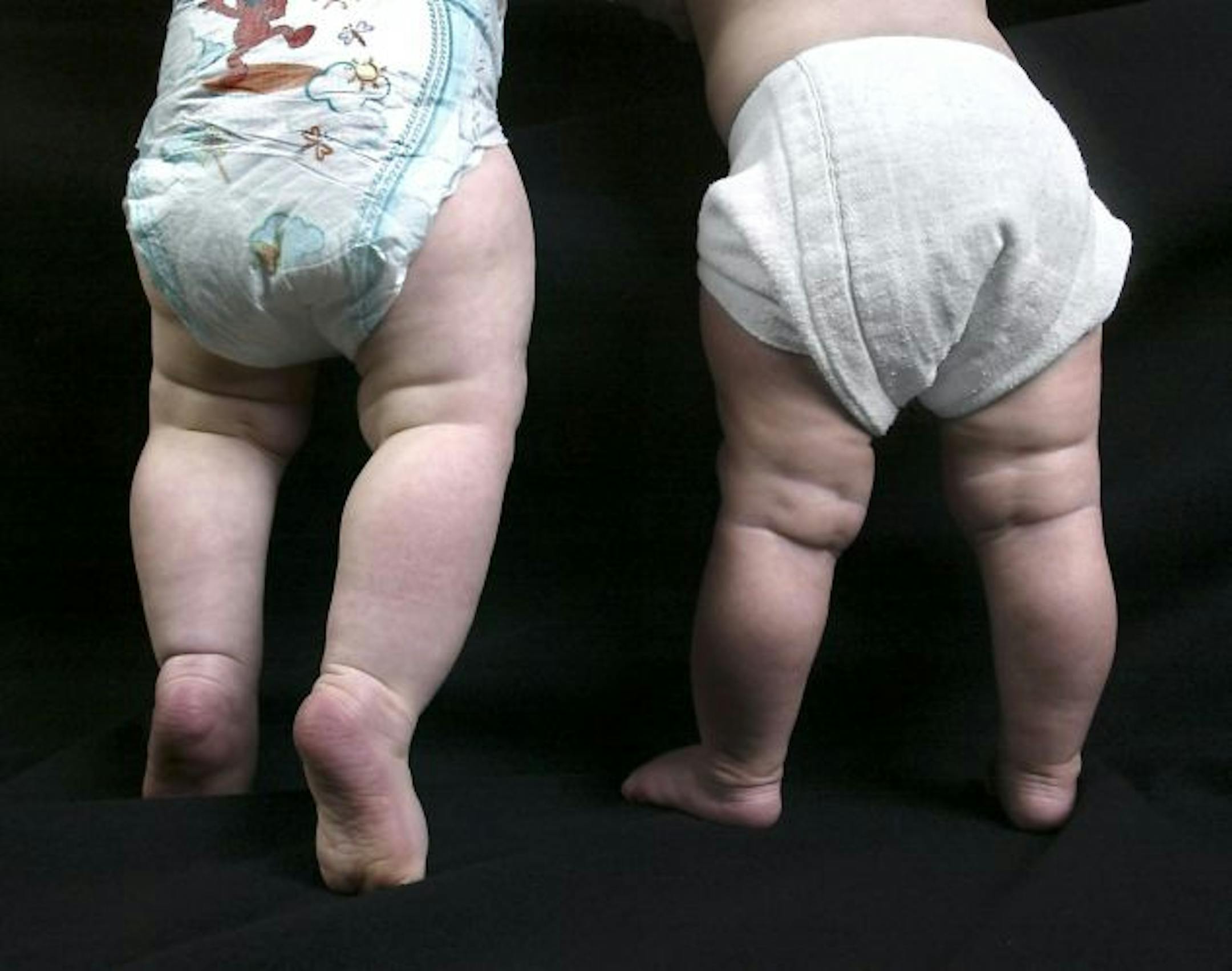 In this photo illustration, the great debate, disposable diapers versus cloth diapers for an environmental choice.
