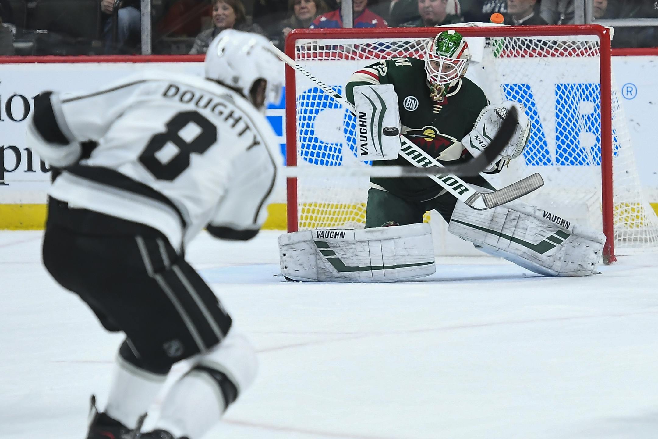 Minnesota Wild goaltender Alex Stalock (32) blocked a shot by Los Angeles Kings defenseman Drew Doughty (8) in the second period.