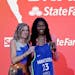 Maryland's Diamond Miller, right, poses for a photo with commissioner Cathy Engelbert after being selected by the Minnesota Lynx at the WNBA basketbal