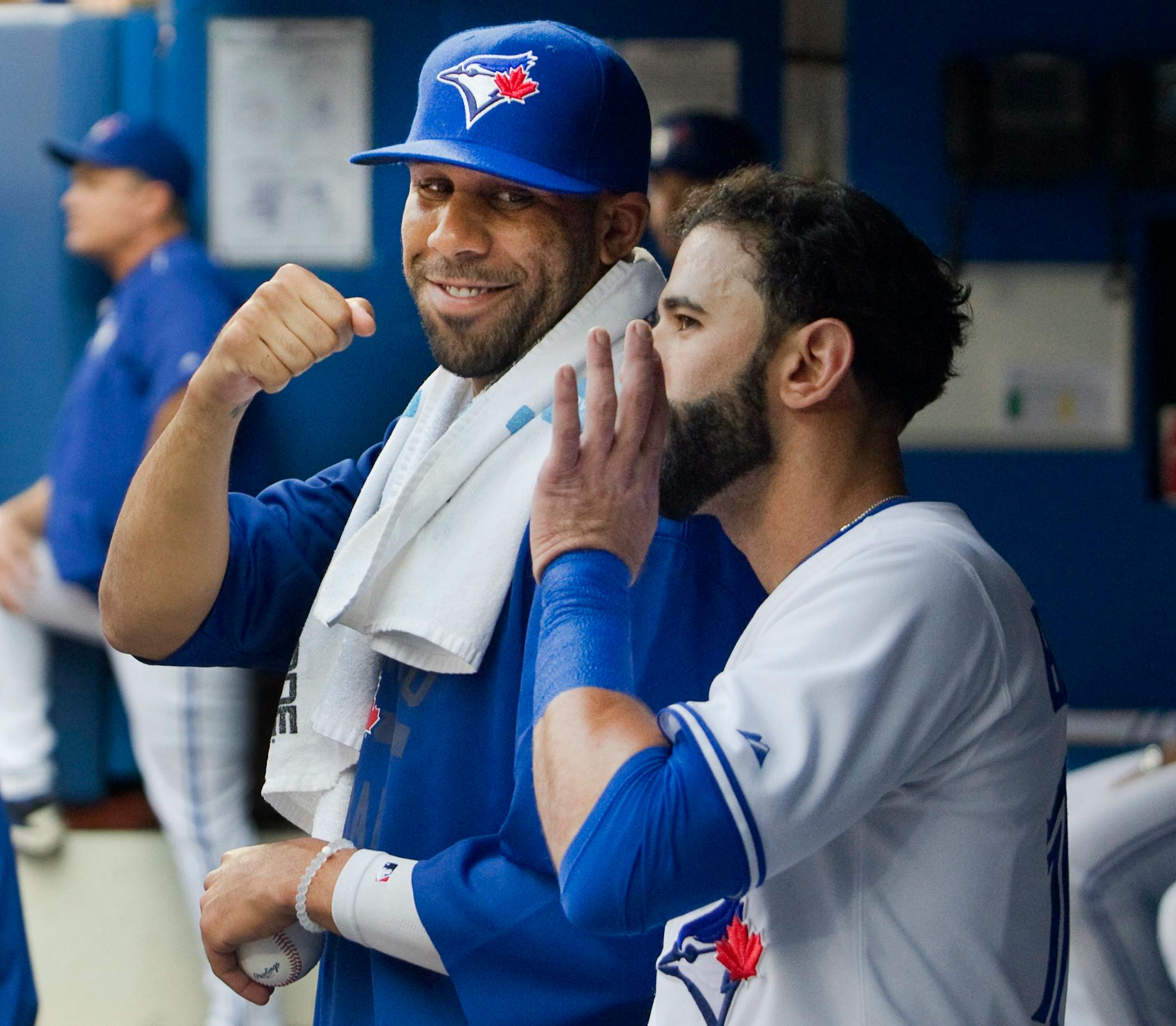 Toronto Blue Jays newly acquired starting pitcher David Price smiles in the dugout with teammate Jose Bautista over the weekend.