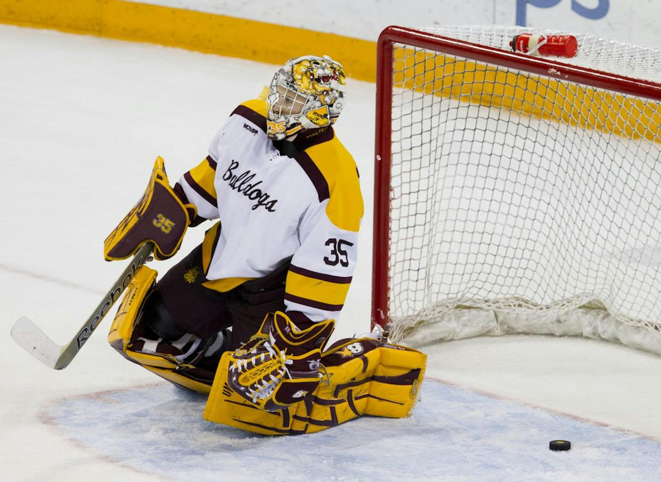 Minnesota Duluth goaltender Kenny Reiter reacts after Minnesota scored with 56 seconds left in overtime to win 5-4 Friday evening at Amsoil Arena in Duluth, Minn.