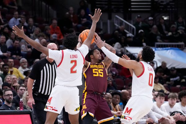 Gophers point guard Ta’lon Cooper (55) was under pressure from Maryland’s aggressive defense in Thursday’s season-ending loss at the Big Ten tou