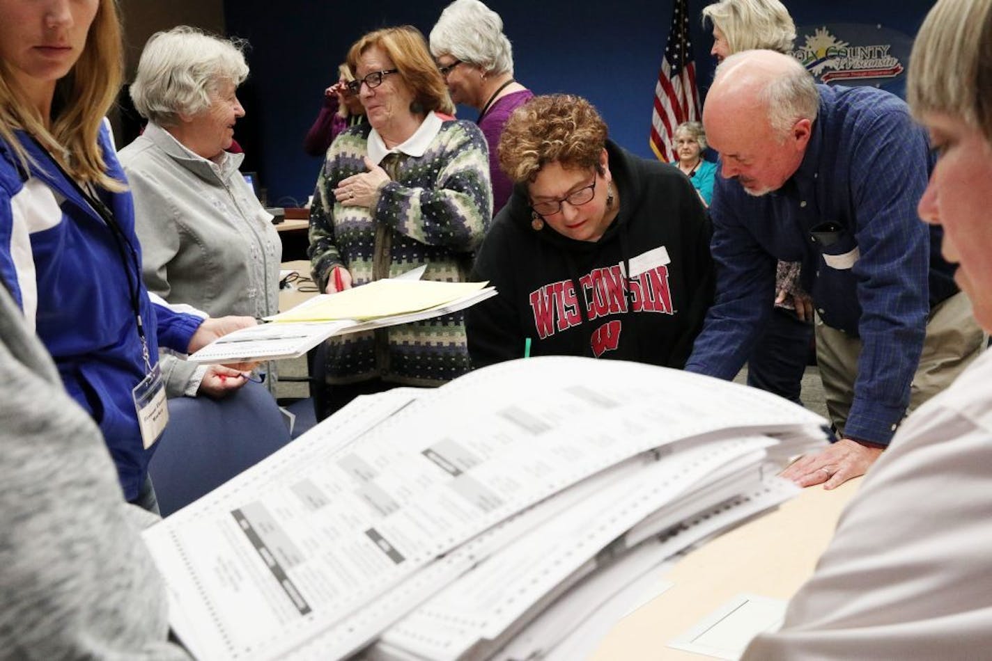 Recount workers sorted ballots during Wisconsin's 2016 presidential recount in Hudson, Wis., on Dec. 1, 2016. Attempted intrusions into the 2016 election were discovered in Arizona and at least 19 other states.