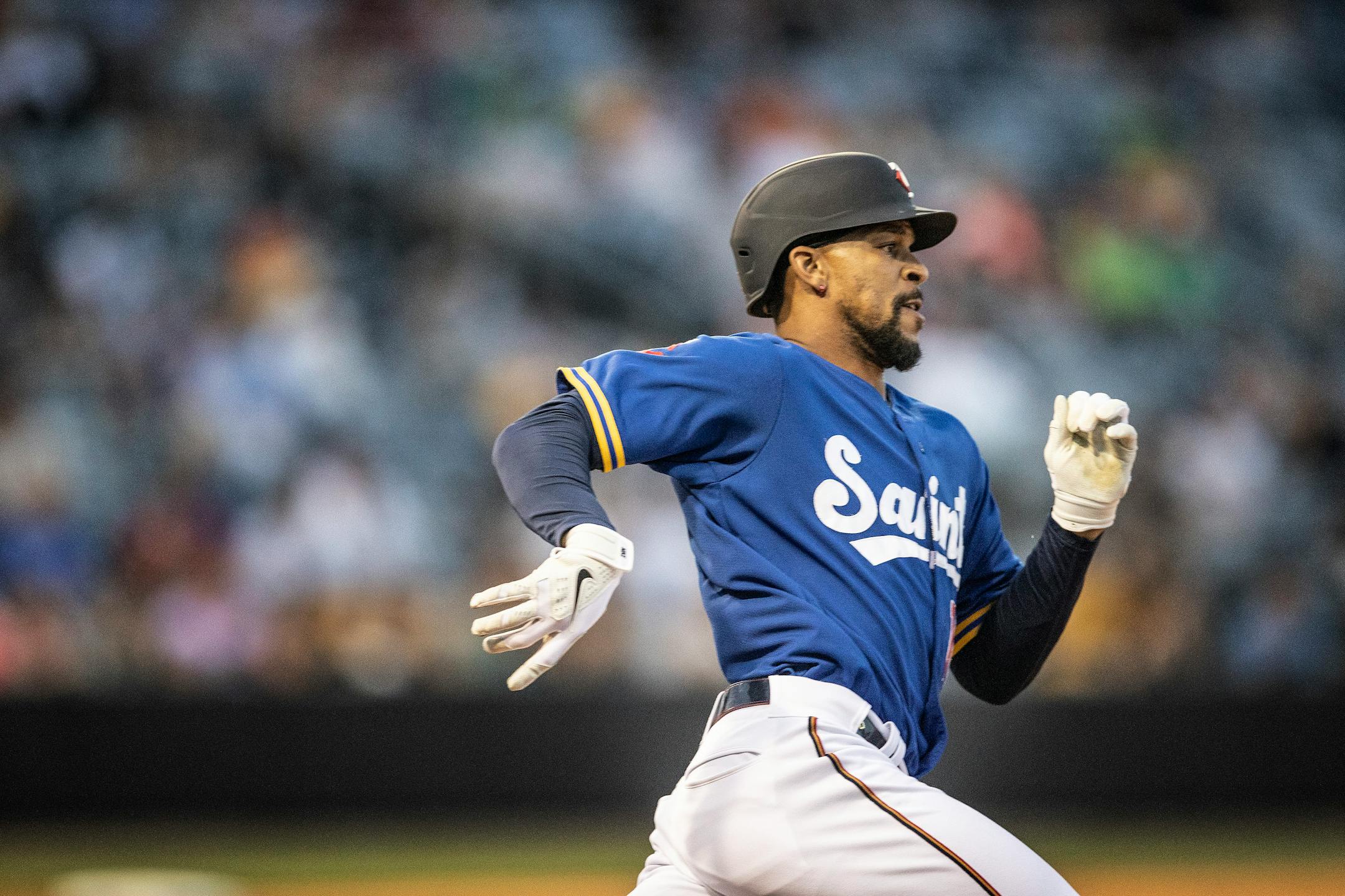 St. Paul Saints' Byron Buxton runs with a triple in the sixth inning against the Omaha Storm Chasers in a minor league baseball game Tuesday, June 8, 2021, in St. Paul, Minn. Buxton is on a rehab assignment. (Jerry Holt/Star Tribune via AP)