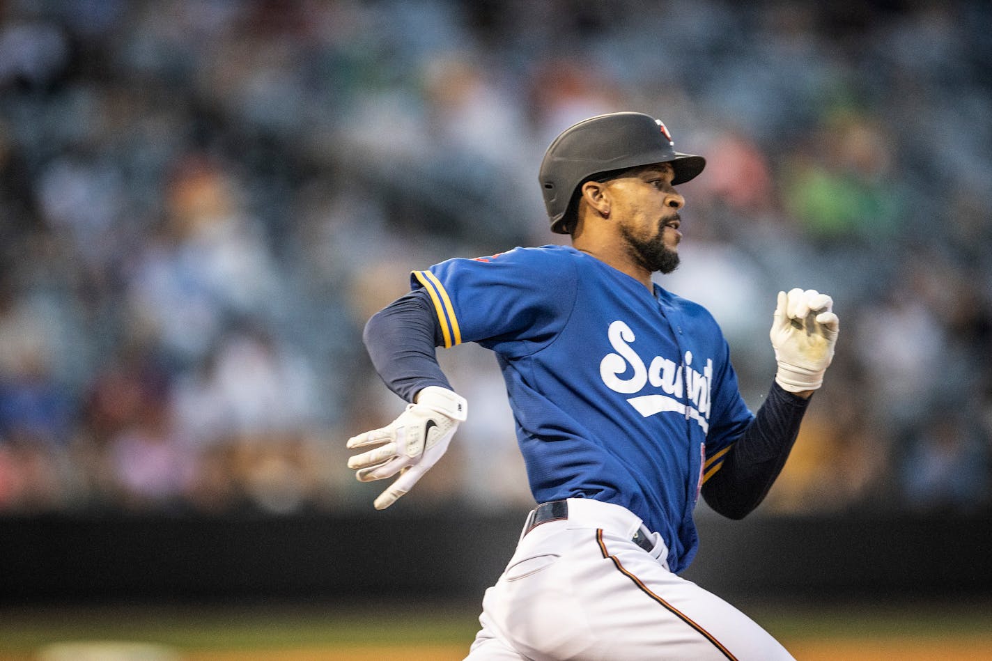 St. Paul Saints' Byron Buxton runs with a triple in the sixth inning against the Omaha Storm Chasers in a minor league baseball game Tuesday, June 8, 2021, in St. Paul, Minn. Buxton is on a rehab assignment. (Jerry Holt/Star Tribune via AP)