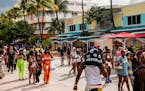 People walked along Ocean Drive during spring break in Miami Beach, Fla., March 6, 2021. Declining infection rates overall masked a rise in more conta