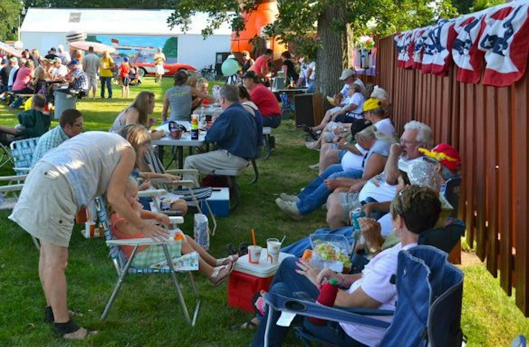It's picnic time outside the A&W drive-in in Spring Valley, Minn., where hundreds gather each year for Cruise Night, which also draws about 400 classic cars.