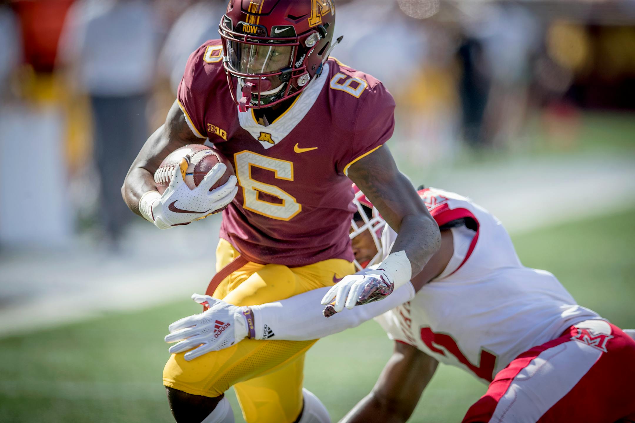 Minnesota's wide receiver Tyler Johnson plowed through Redhawks defensive back Joshua Allen for a touchdown