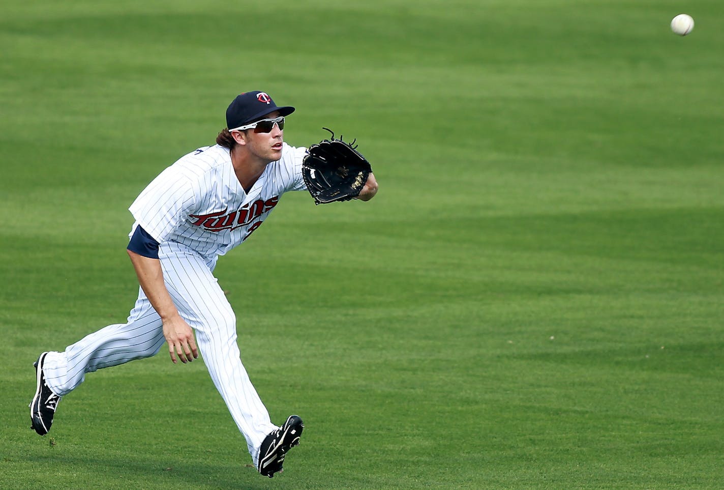 Trevor Plouffe tracked down a ball during spring training.