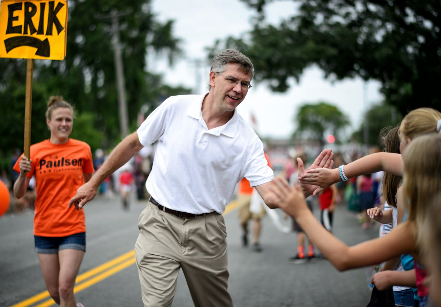 Republican Congressman Erik Paulsen greeted people at the Edina Fourth of July parade. His DFL challenger State Senator Terri Bonoff also marched in the parade. ] GLEN STUBBE * gstubbe@startribune.com Monday, July 4, 2016 The Edina Fourth of July parade. EDS, for use with any appropriate story. GS