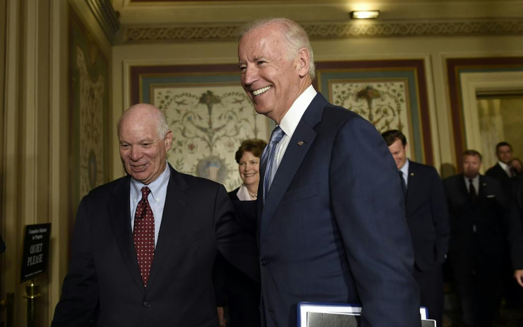 Vice President Joe Biden walks with Senate Foreign Relations Committee members Sen. Ben Cardin, D-Md., left, and Sen. Jeanne Shaheen, D-N.H., center, on Capitol Hill in Washington, Thursday, July 16, 2015, for a meeting with Democrats members of the committee to pitch the nuclear agreement with Iran.