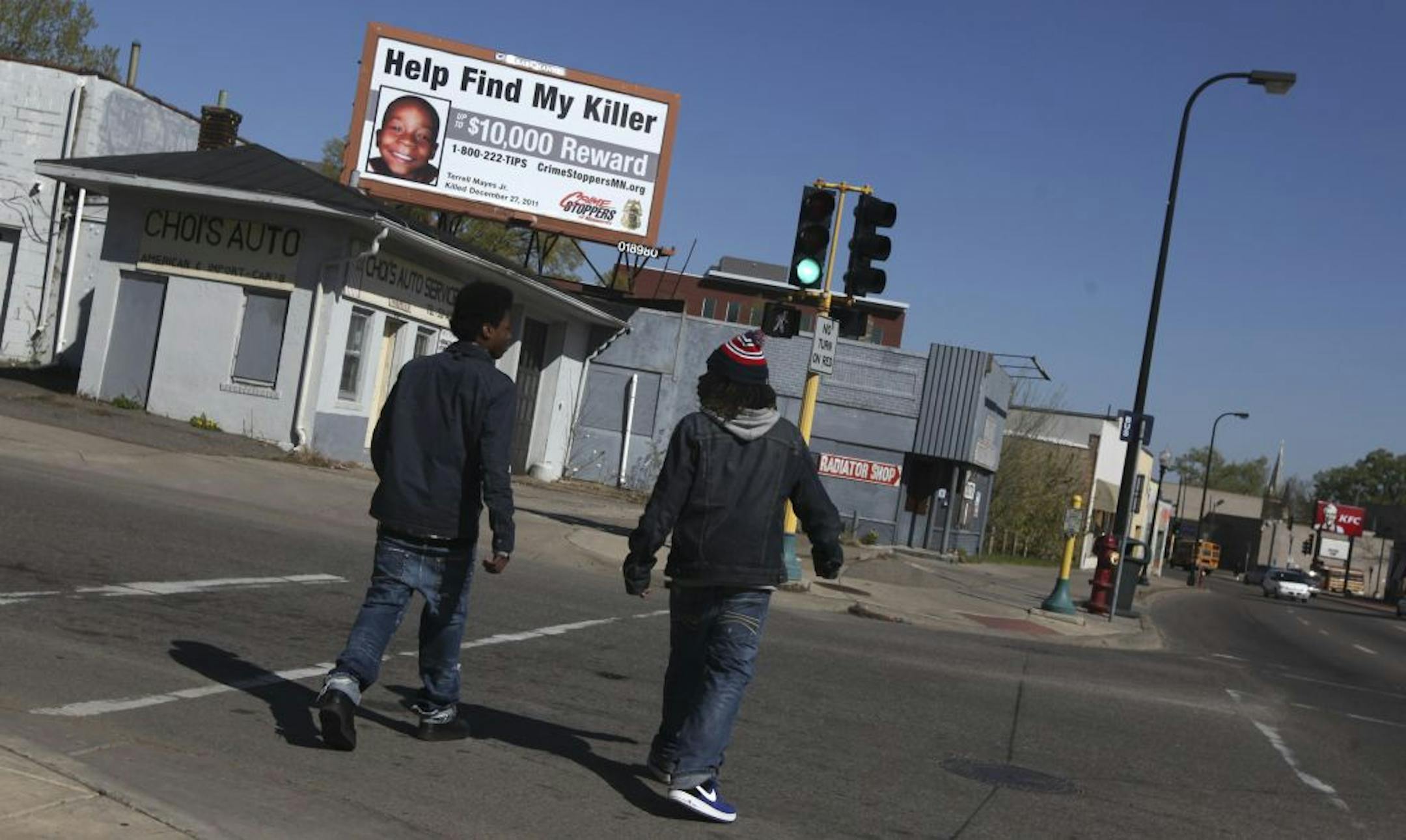 A billboard for crime victim Terrell Mayes Jr. looms just down the street from the Capri, where the mayor spoke.