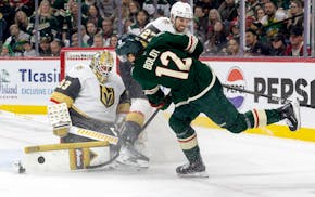 Vegas Golden Knights goalie Adin Hill (33) blocks a shot by Matt Boldy (12) of the Wild in the first period at Xcel Energy Center in St. Paul, Thursda