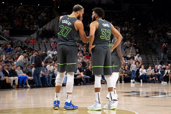 Rudy Gobert and Karl-Anthony Towns had a discussion during the Timberwolves’ loss at San Antonio on Sunday.
