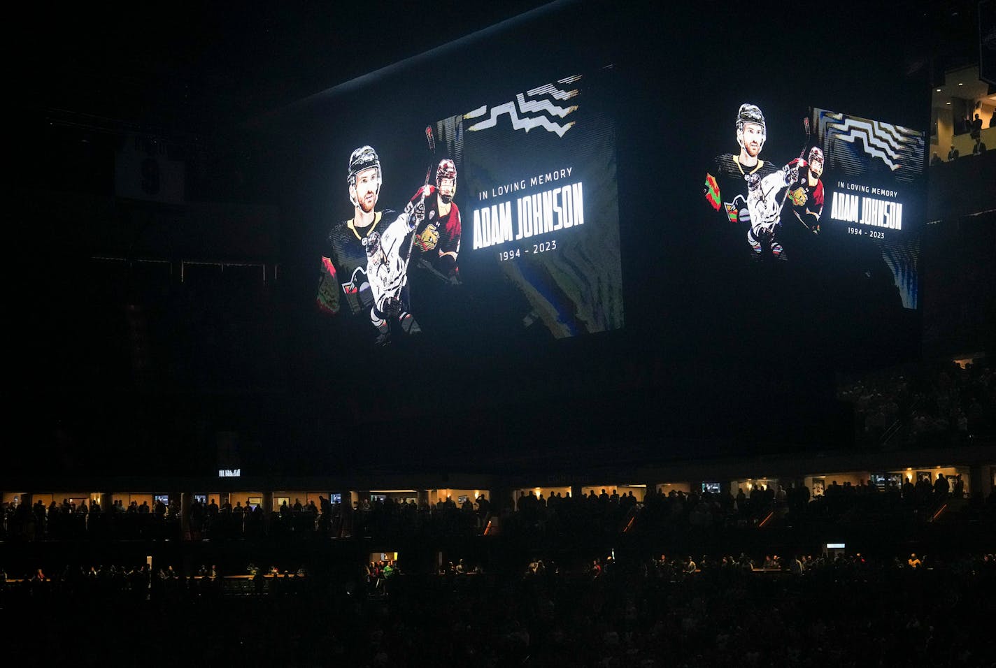 A moment of silence in a dark arena for Adam Johnson before the game. The Minnesota Wild hosted the New Jersey Devils at the Xcel Energy Center on Thursday, Nov. 2, 2023 in St. Paul, Minn. ] RENEE JONES SCHNEIDER • renee.jones@startribune.com