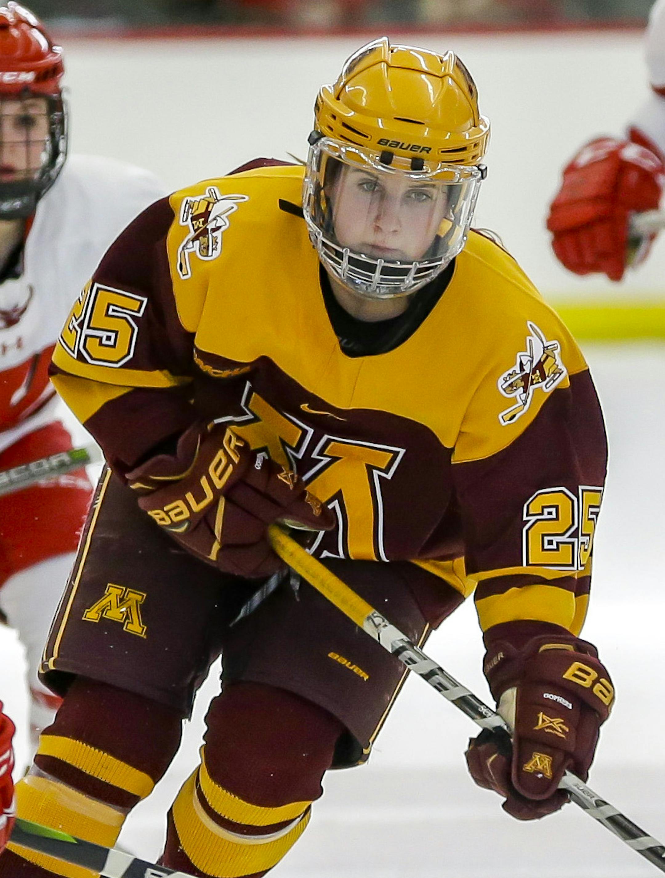Minnesota's Nicole Schammel (25) drives against Wisconsin's Mikaela Gardner (4) during the second period of an NCAA Frozen Four quarterfinal March 10, 2018, in Madison, Wis. (Photo © Andy Manis)