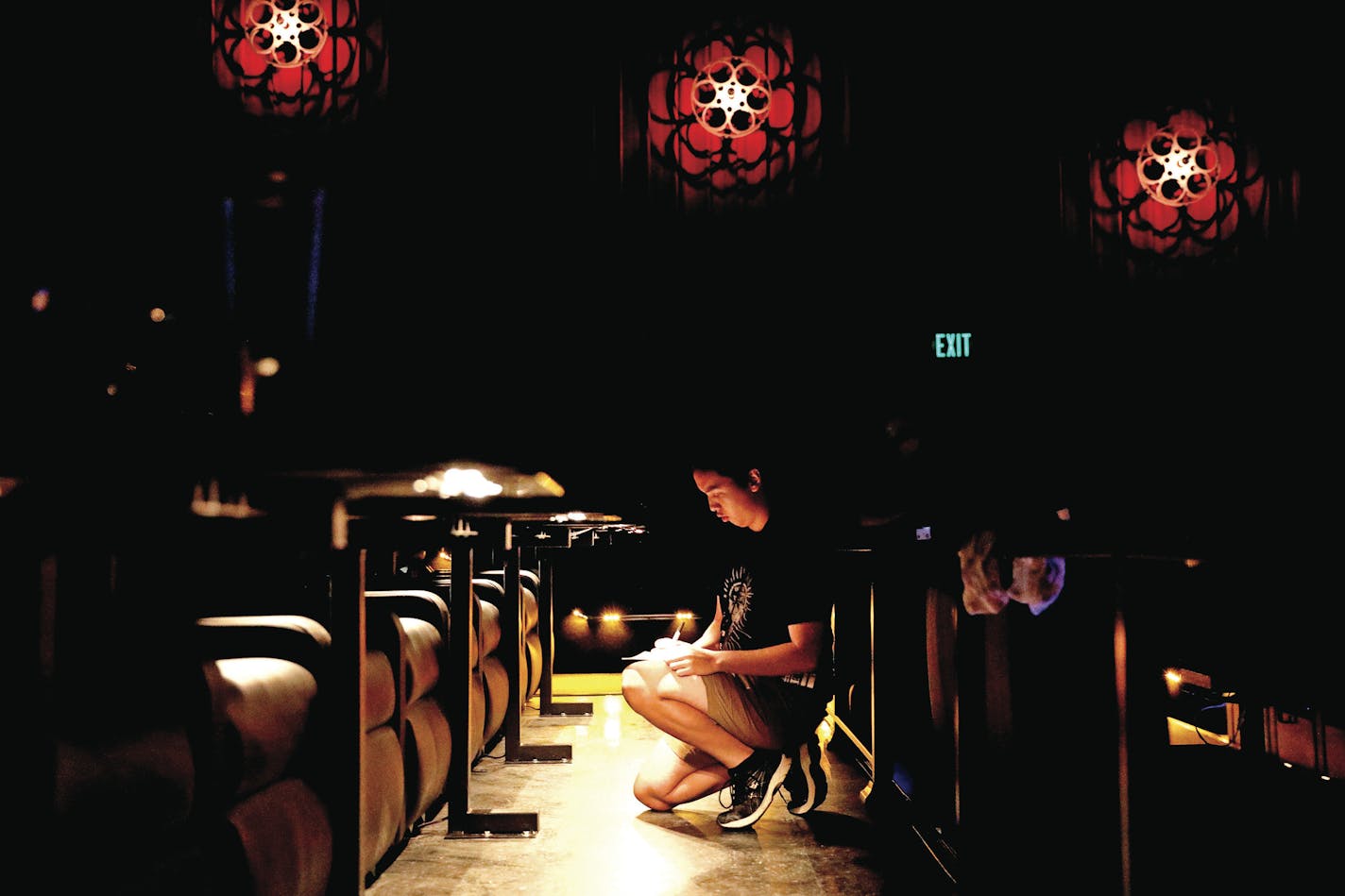 Staff practiced ducking past moviegoers and crouching to take food orders during a training session at Alamo Drafthouse Cinema. ] ANTHONY SOUFFLE &#xef; anthony.souffle@startribune.com Executives from Alamo Drafthouse Cinema gave a media tour of their first Twin Cities location opening soon Tuesday, July 17, 2018 in Woodbury, Minn. The Texas based chain touts a movie lovers experience with notable comfort food, craft beers, and state-of-the-art technology.