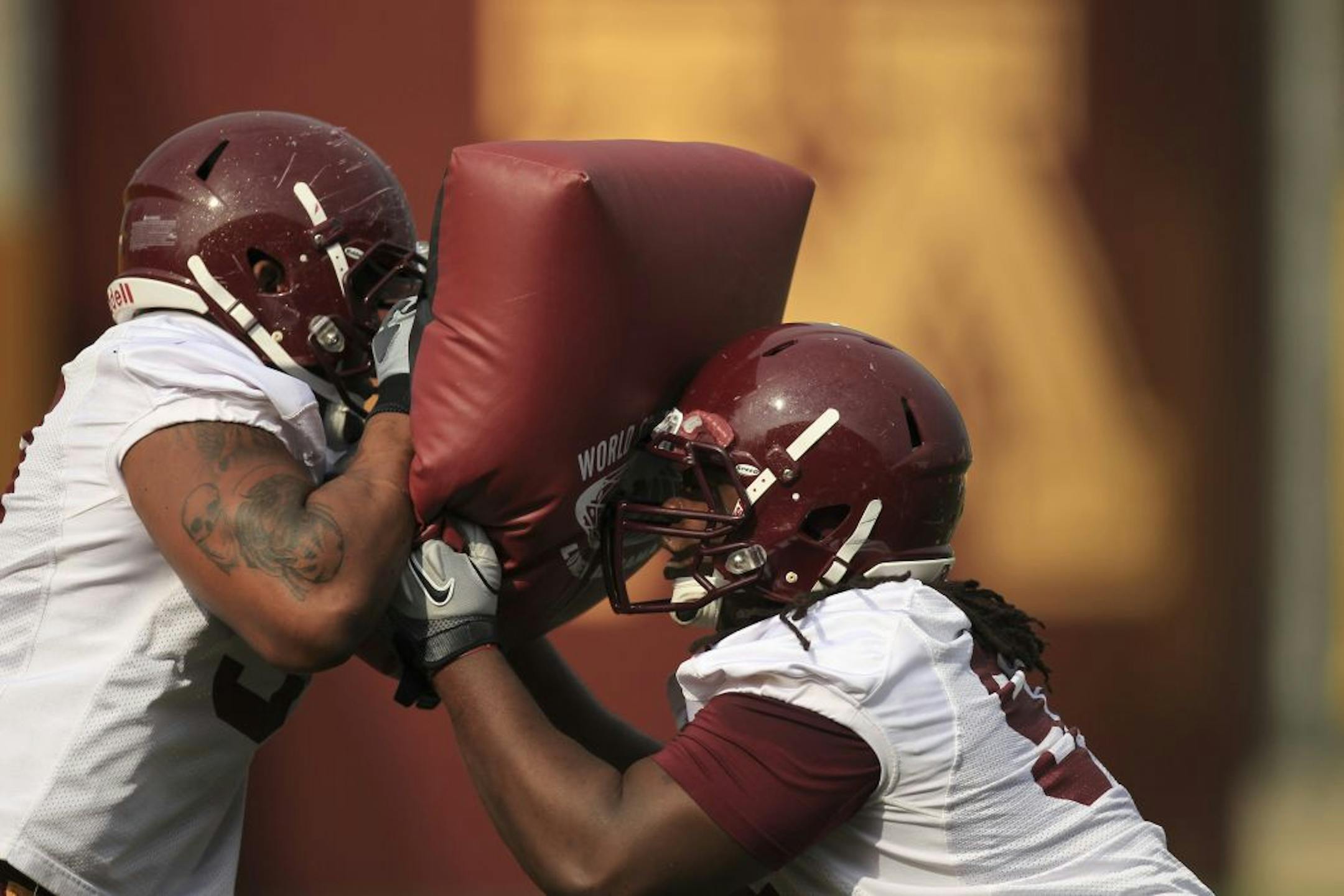 Defensive linemen Ra'Shede Hageman, left, and Harold Legania drilled together on the first day of spring practice last week.