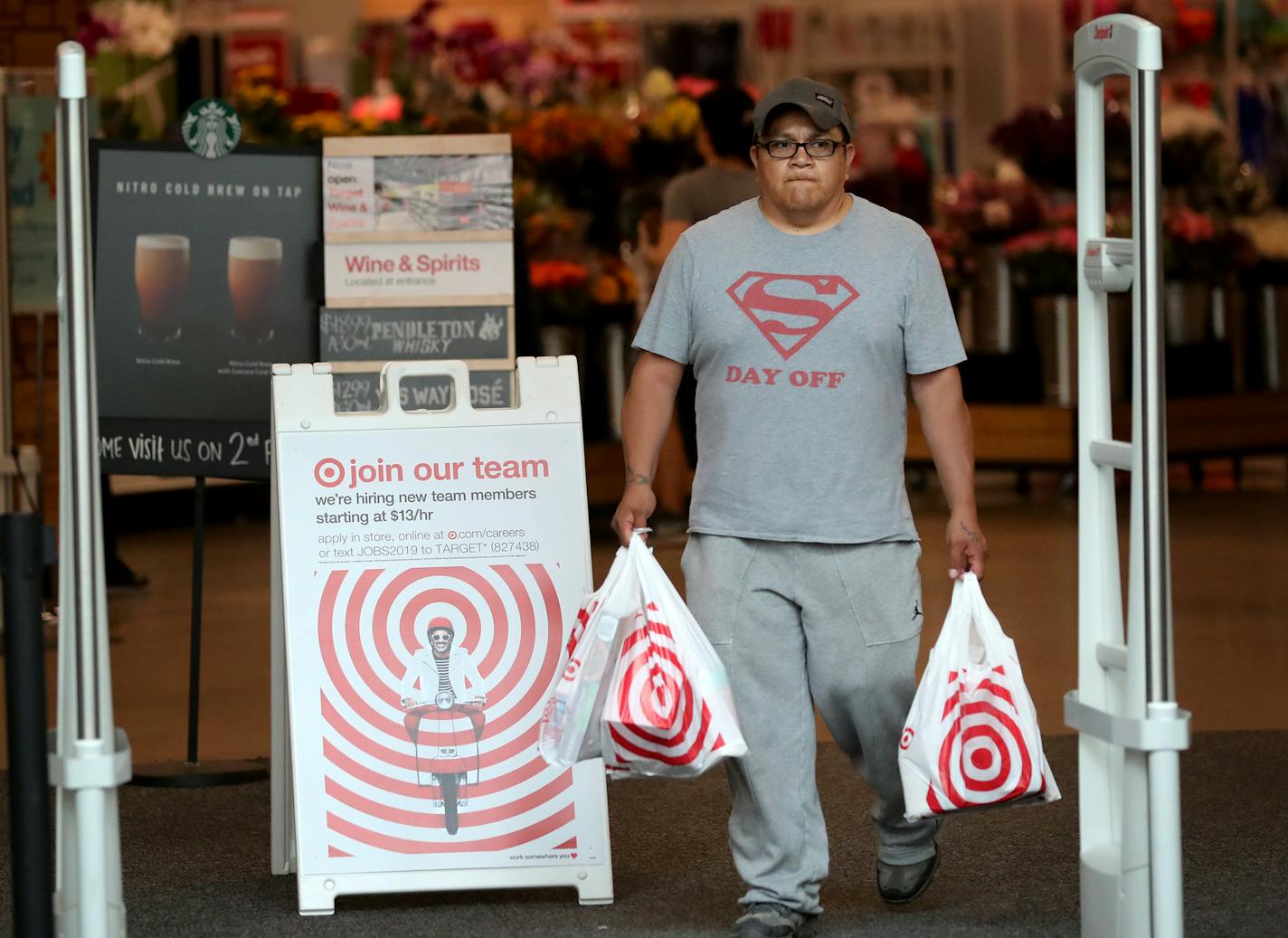 A shopper left the Nicollet Mall Target in downtown Minneapolis on Saturday, a day when many reported long waits to check out. The retailer also reported technical glitches on Sunday.