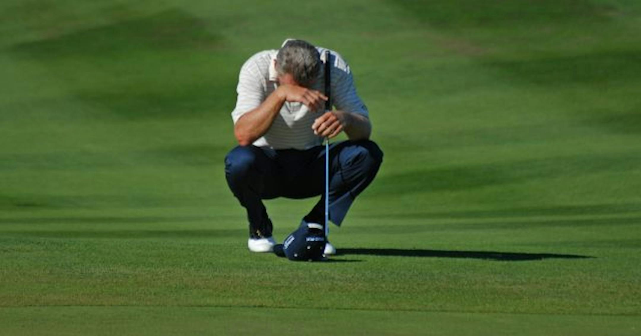 Nick Price waiting to putt on the 17th