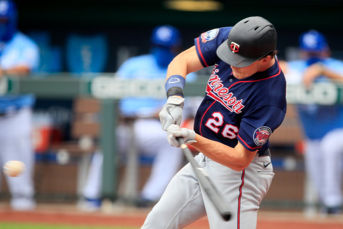 Minnesota Twins Max Kepler hits an RBI double during the third inning of a baseball game against the Kansas City Royals at Kauffman Stadium in Kansas City, Mo., Sunday, Aug. 9, 2020. (AP Photo/Orlin Wagner)