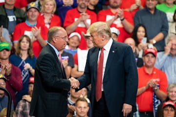 President Donald Trump greeted GOP candidate for Congress in the first district, Jim Hagedorn, on stage Thursday night at Mayo Civic Center in Rochest