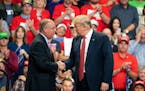 President Donald Trump greeted GOP candidate for Congress in the first district, Jim Hagedorn, on stage Thursday night at Mayo Civic Center in Rochest