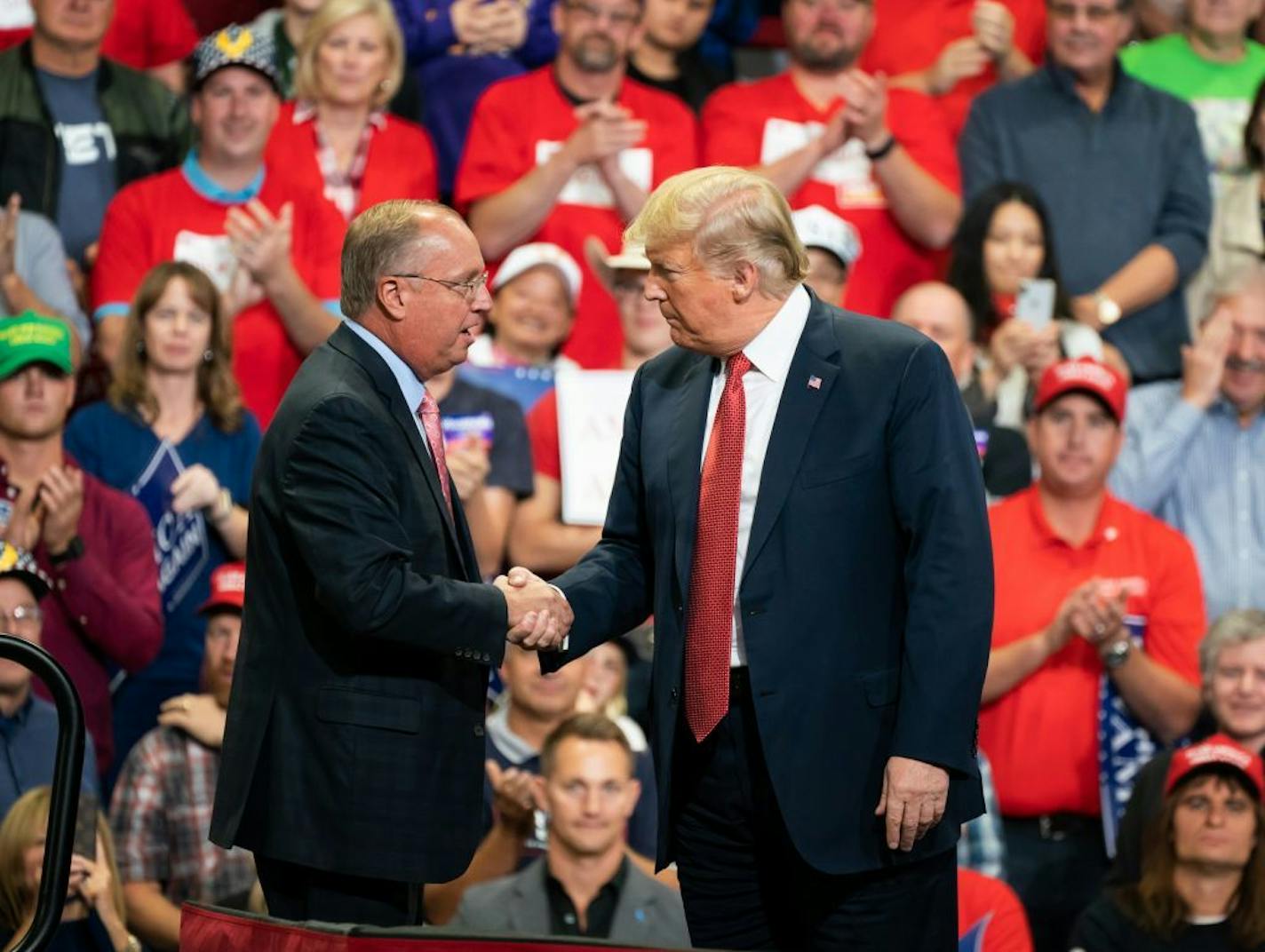 President Donald Trump greeted GOP candidate for Congress in the first district, Jim Hagedorn, on stage Thursday night at Mayo Civic Center in Rochester.