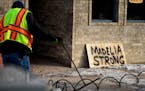 A city water crew worked in front of the La Plaza Fiesta Mexican Restaurant where a handmade Madelia Strong sign was placed. ] GLEN STUBBE * gstubbe@s
