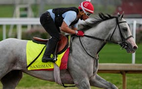 Kentucky Derby entrant Sandman works out at Churchill Downs on Tuesday in Louisville, Ky.