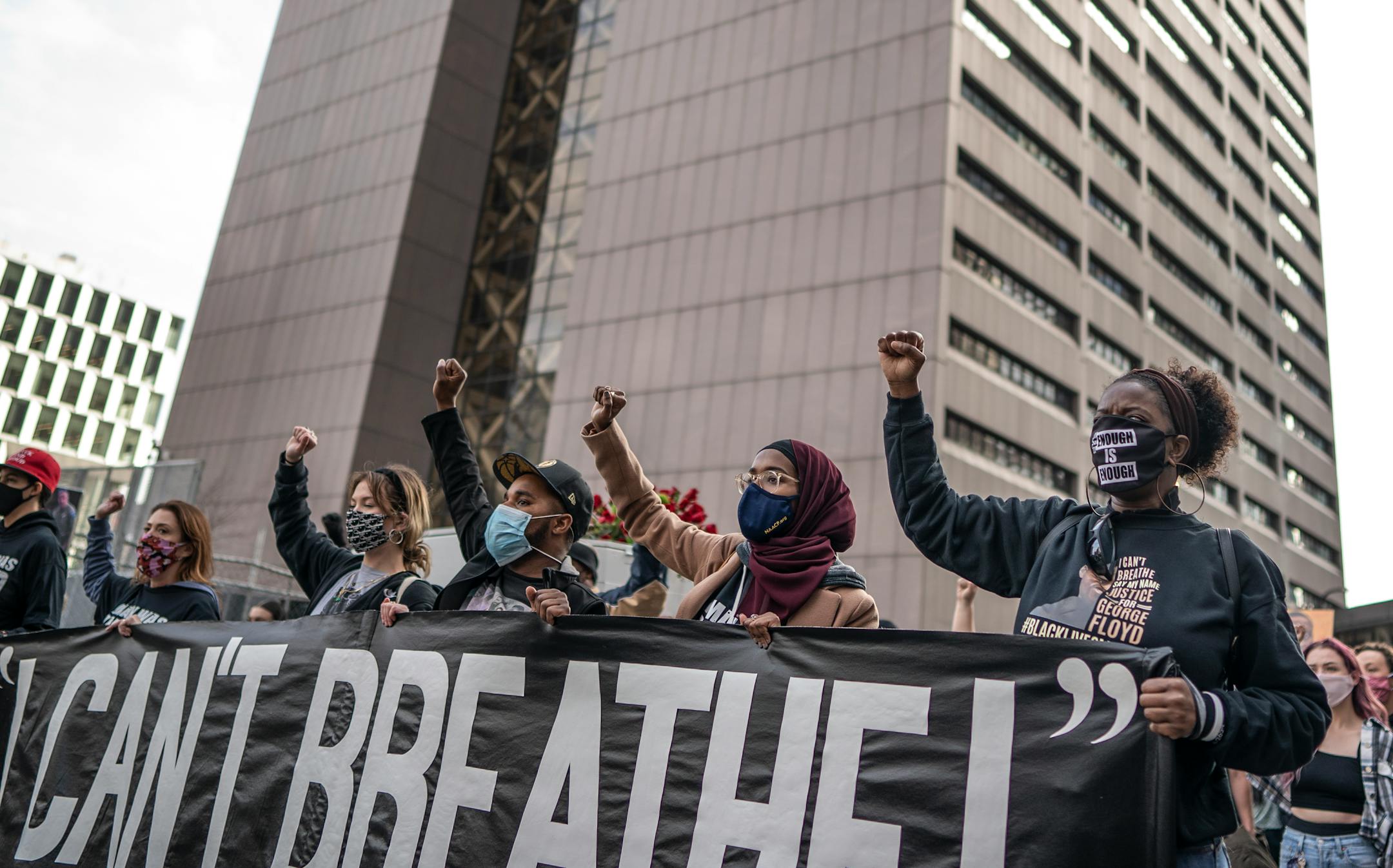 Demonstrators marched passed the Hennepin County Government Center one day before jury selection is set to begin in the trial of former Minneapolis officer Derek Chauvin.
