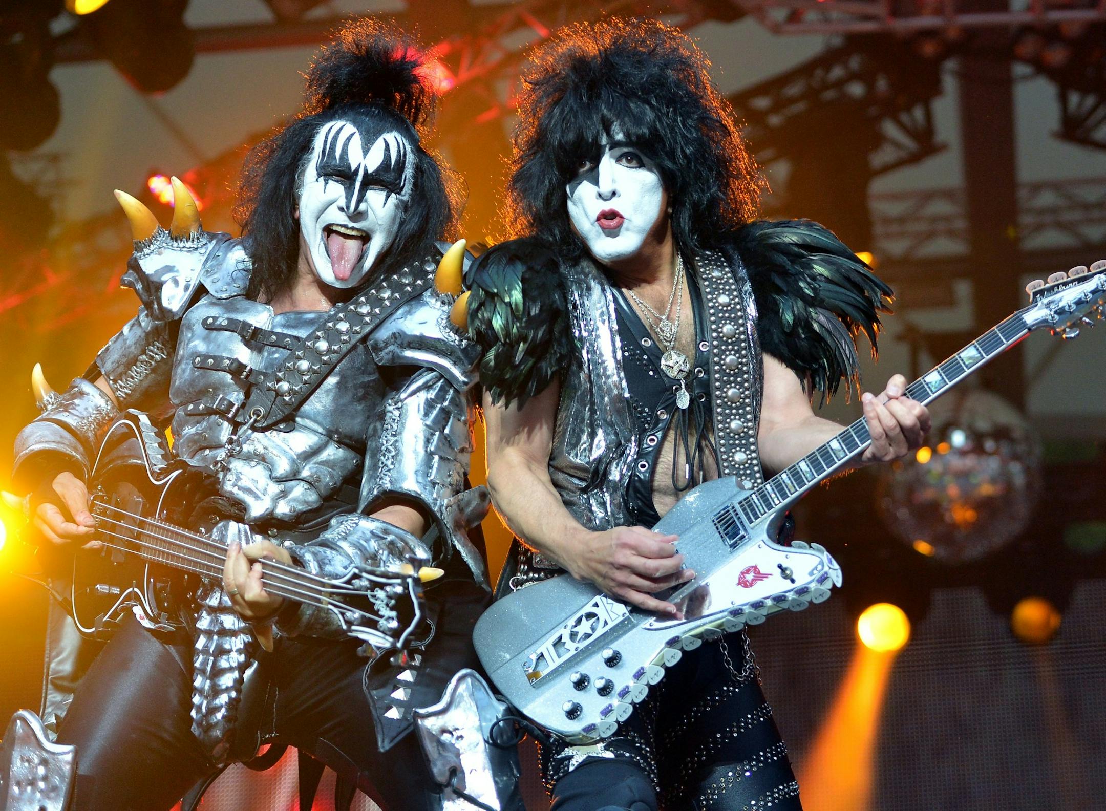 In this picture, made available Thursday June 13, 2013, bassist Gene Simmins, left, and singer Paul Stanley of the US band Kiss perform on stage in Berlin, Germany, Wednesday June 12, 2013. It is the only concert of the rock group in Germany during their Monster Tour 2013. (AP Photo/dpa,Britta Pedersen)