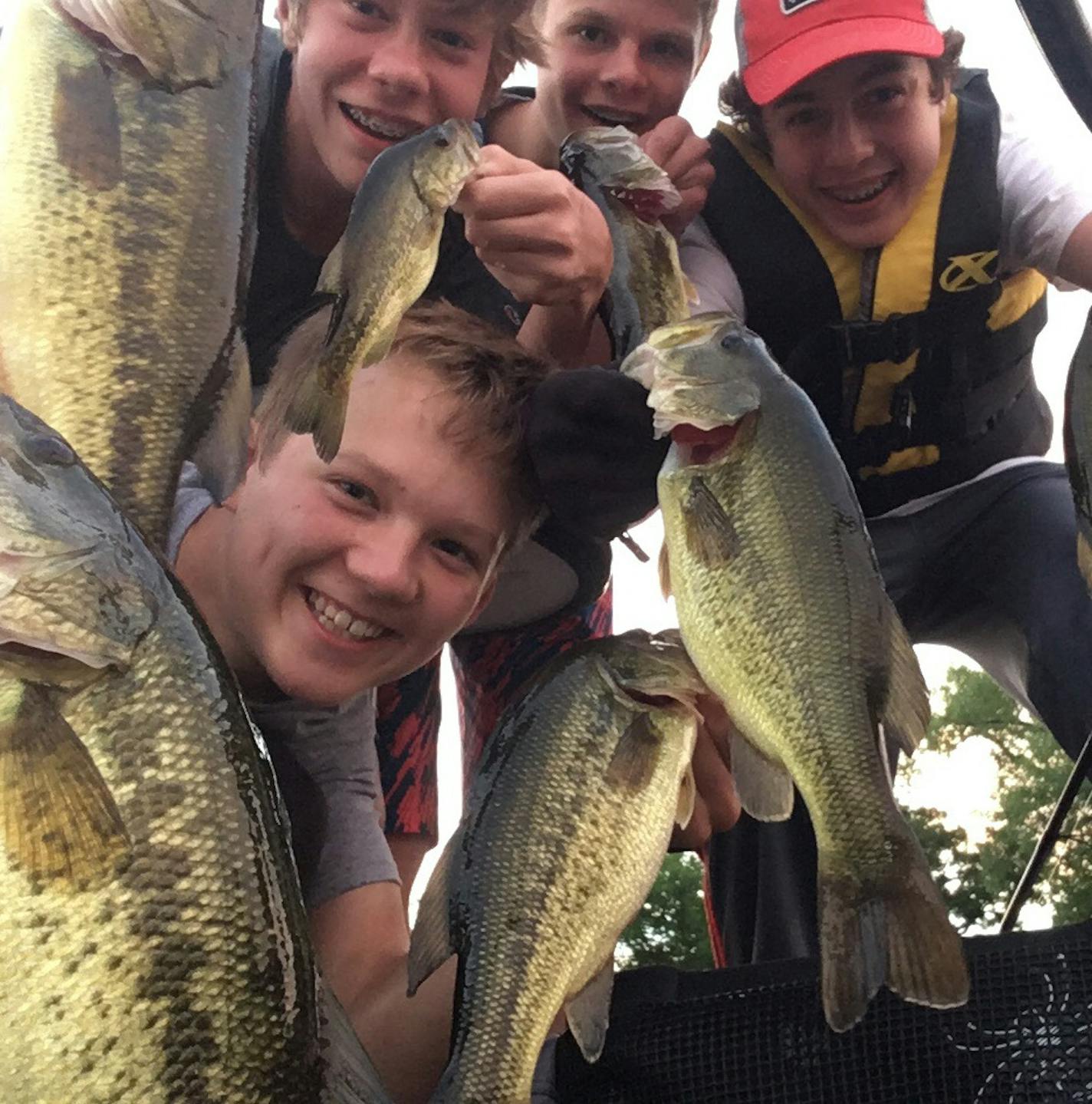 A group of Minnetonka fishermen show off their catch.