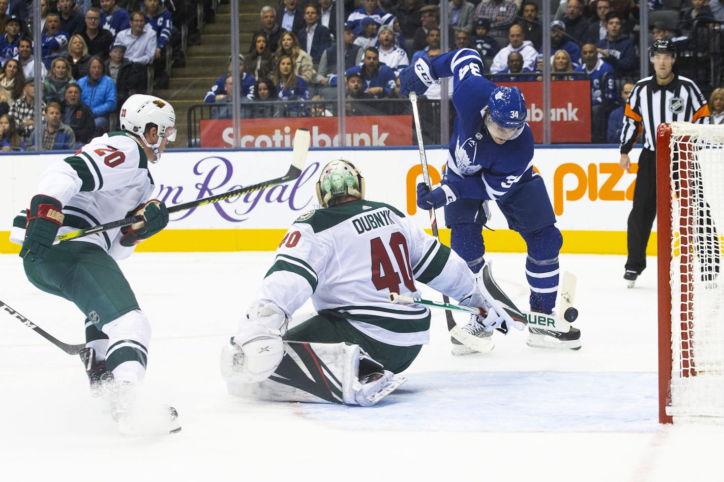 The Maple Leafs' Auston Matthews, right, scored on Wild goaltender Devan Dubnyk during Toronto's four-goal second period Tuesday.