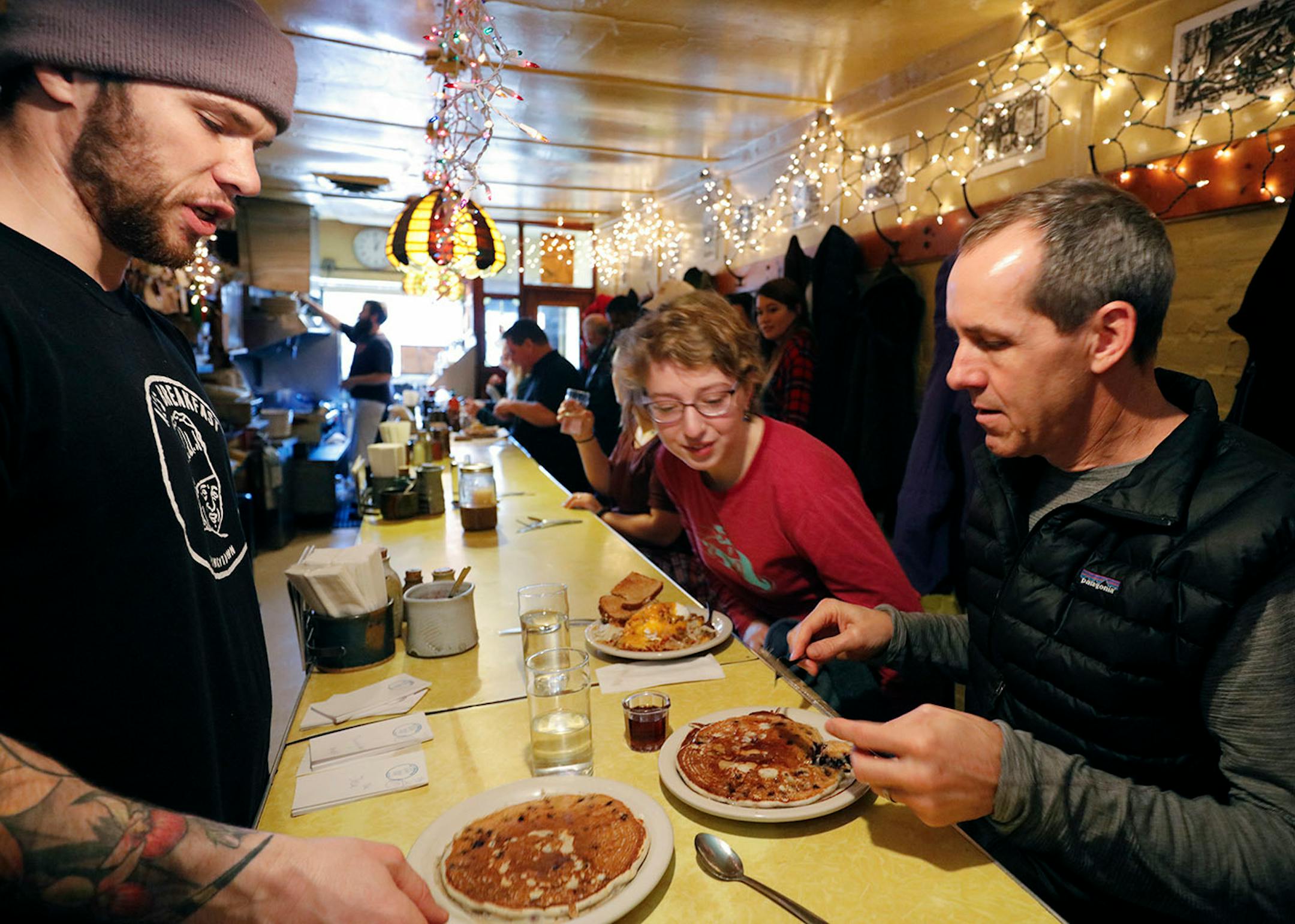 Ken Grina doug's son waits on customers. ..... A changing of the guard at the institution, Al's Breakfast. Doug Grina, one of the original owners and Alison Kirwin, his new partner, at the tiny 14-seat restaurant. Some of the food they are famous for are dishes like the, blueberry/walnut pancakes, bacon waffle, and the "Jose."