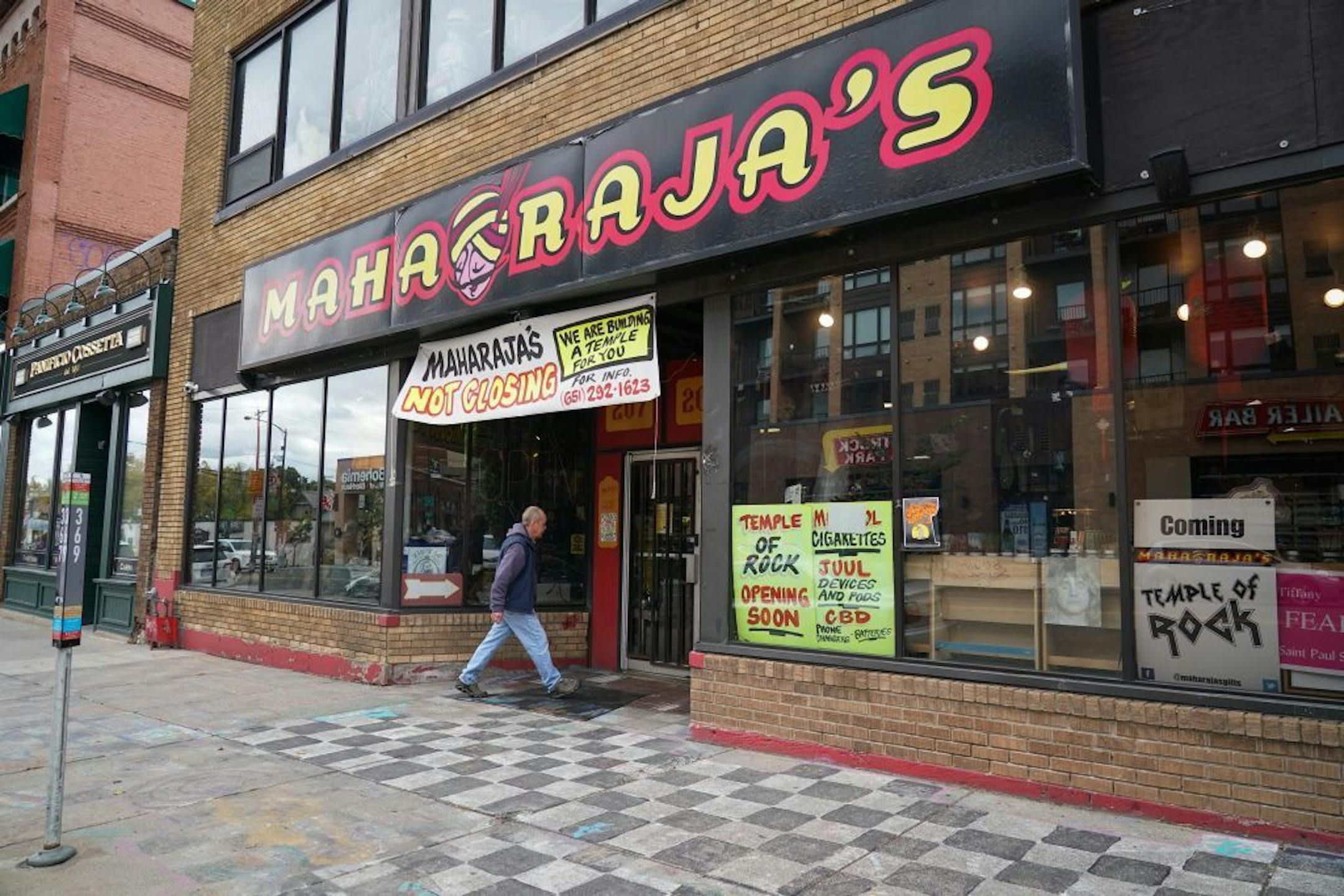 Maharaja's has stood on West Seventh in St. Paul since the 1980s. After a four-year dispute, the city is removing some of the store's sidewalk art.