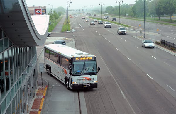 Commuters boarded a bus at the Apple Valley Transit Station south of County Road 42 on Cedar Avenue.