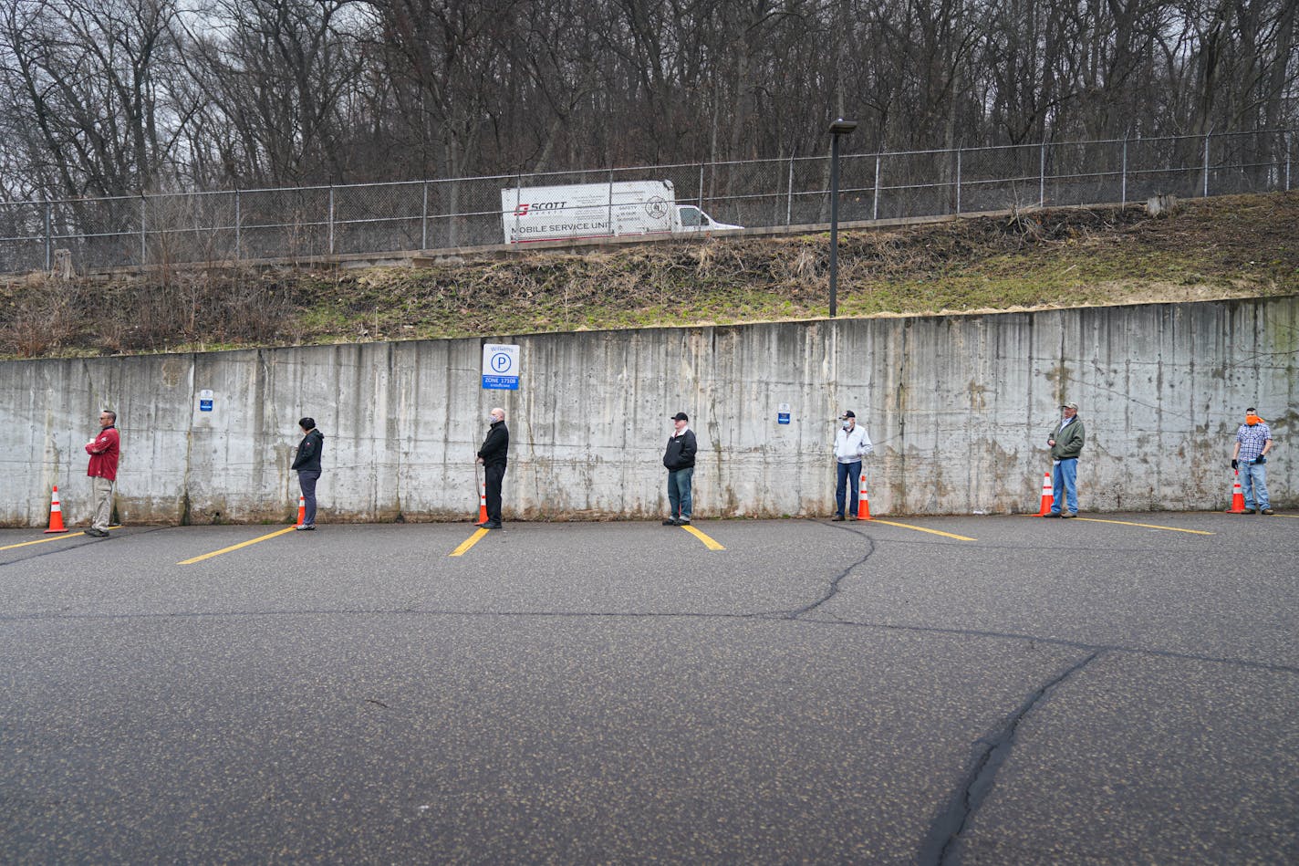 Voters in Hudson, Wisconsin, were allowed into the firehouse one by one to vote in Tuesday's primary. They lined up next to cones in the parking lot that were 10 feet apart.