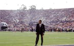 O.J. Simpson stands near the end zone before the start of Super Bowl XXVII in 1993 as an analyst for NBC. At the height of his fame, polls indicated S