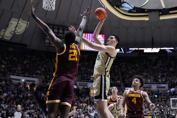 Purdue center Zach Edey put up a bucket over Gophers forward Pharrel Payne during the second half Thursday. Edey finished with 24 points and 15 reboun