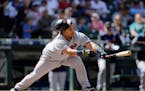 The Twins' Willians Astudillo lost his helmet as he lined out against the Mariners in the eighth inning Sunday. Seattle won 7-4, but the Twins took th