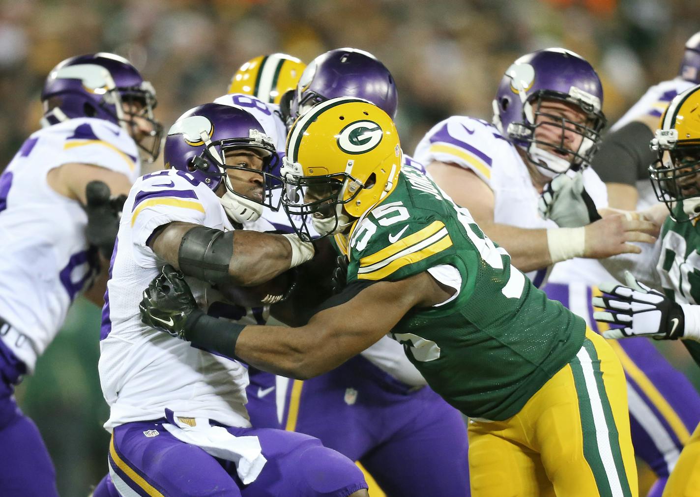 Vikings running back Adrian Peterson was stopped for no gain by Green Bay defensive end Datone Jones in 2016. Jones on Tuesday signed with the Vikings as a free agent.