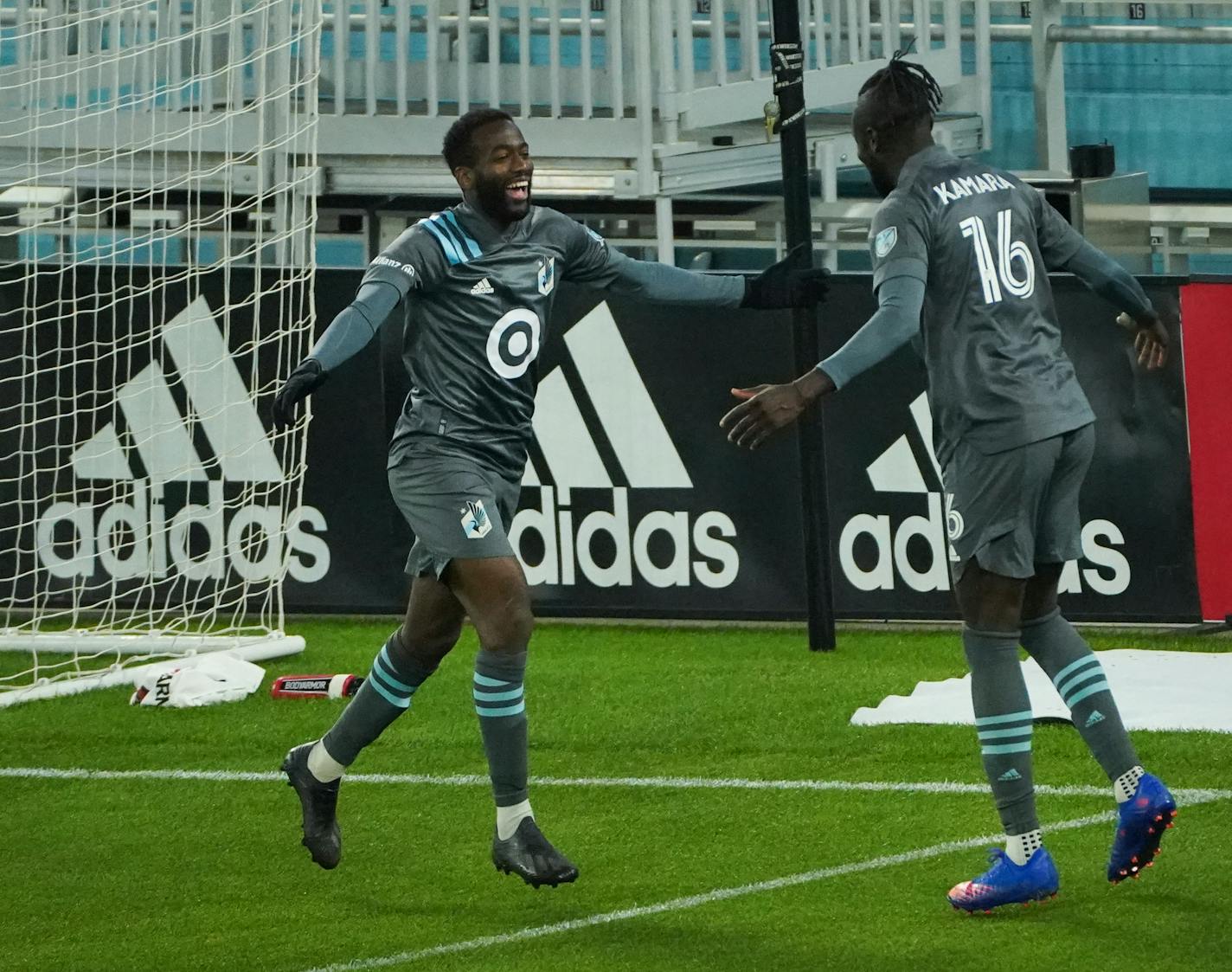 Minnesota United midfielder Kevin Molino ran toward teammate Kai Kamara (16) to celebrate after scoring a goal Oct. 3